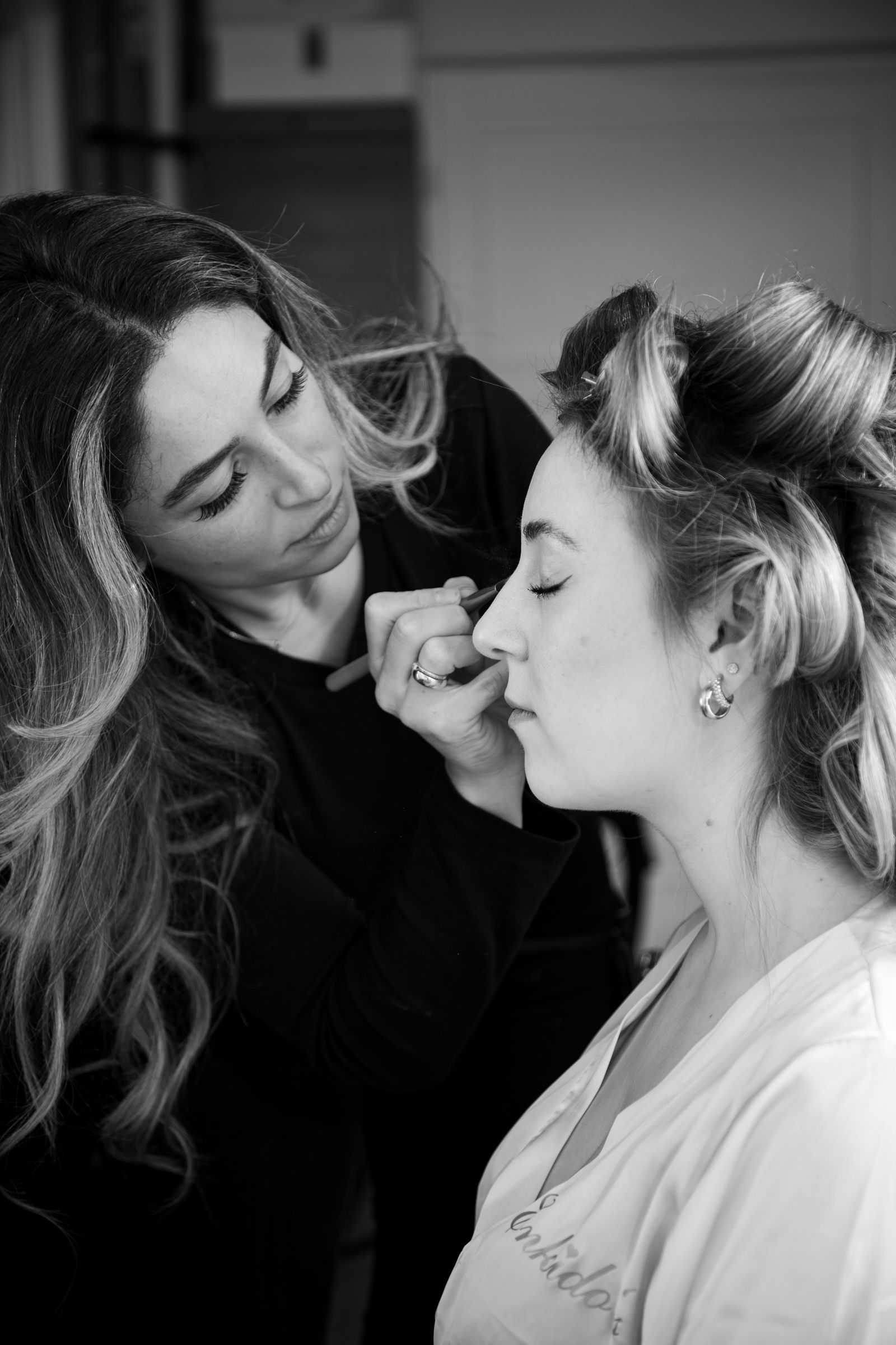 Close-up of an esthetician carefully applying a treatment to a client