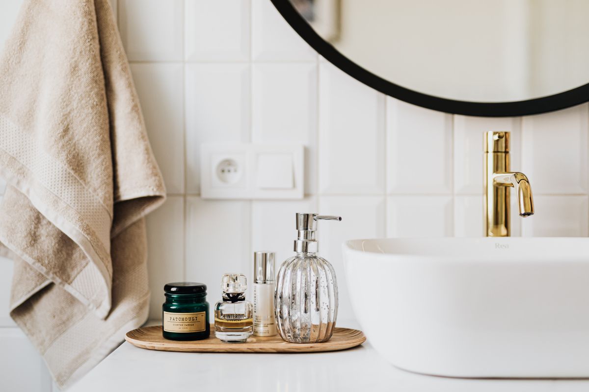 Skincare products arranged on a bathroom counter for a personalized pigmentation routine